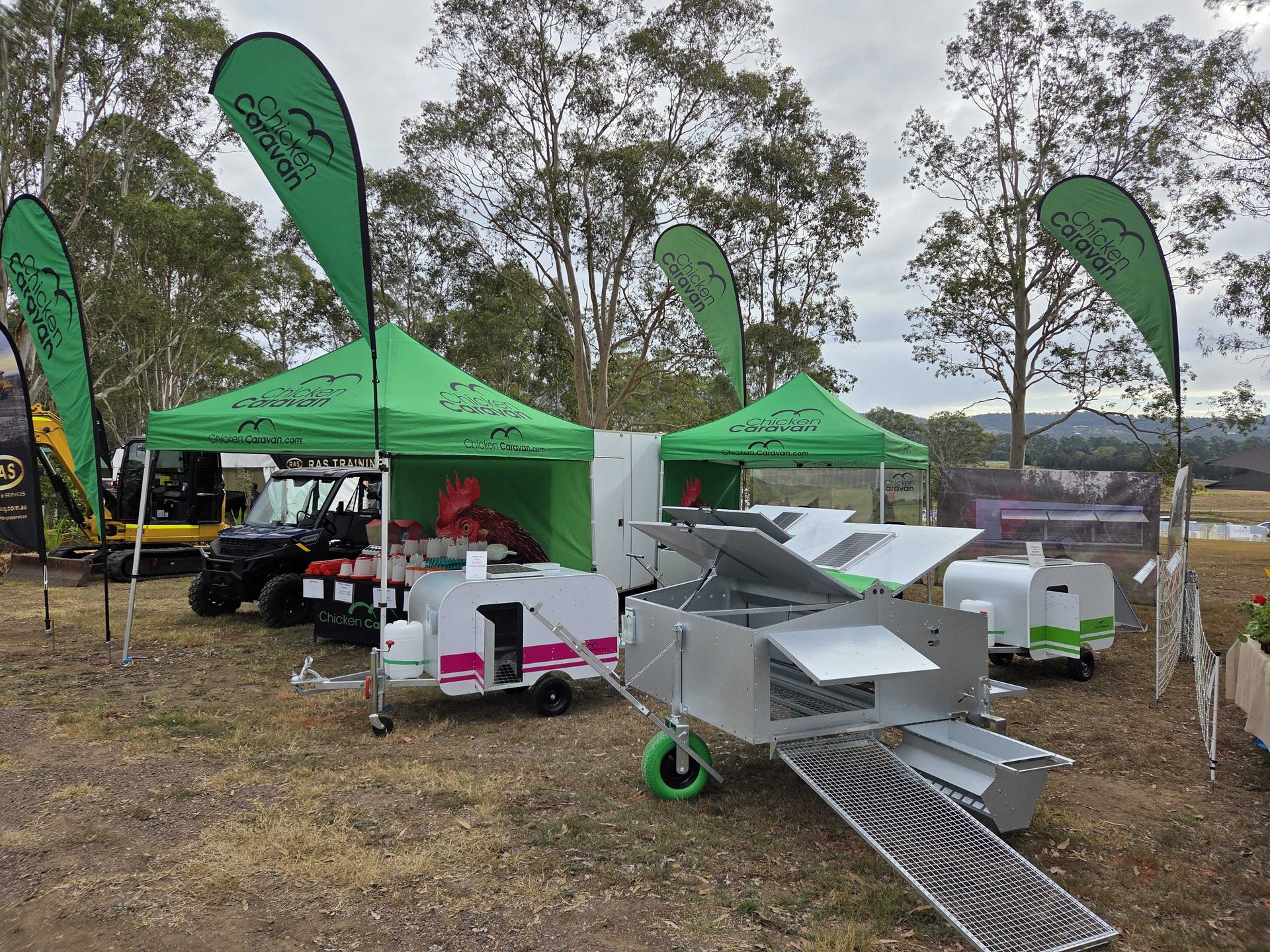 Chicken Caravan all set up at field day with products to display including Chicken Caravan 30 and 10