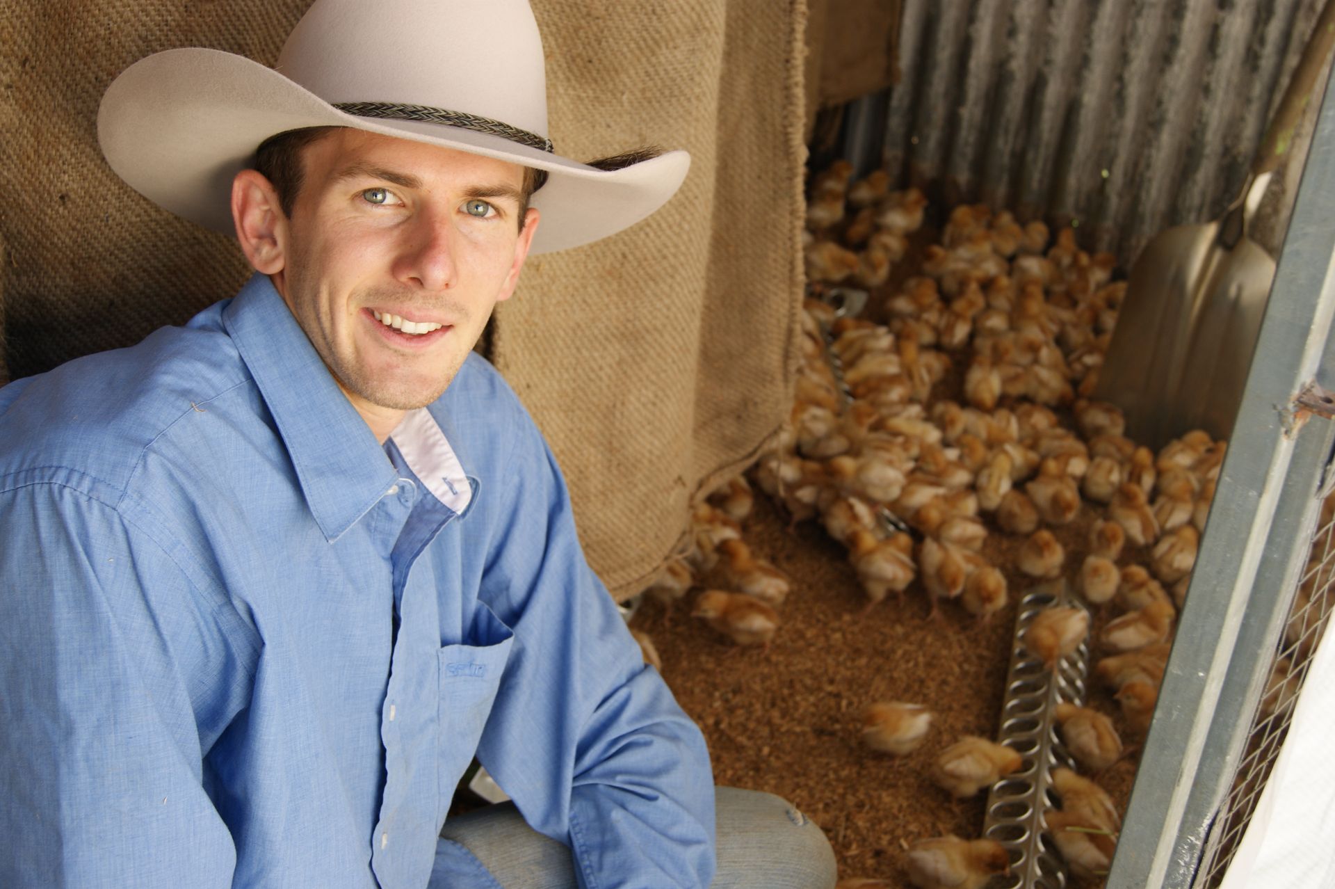 Daniel with his growing chicks Chicken Caravan