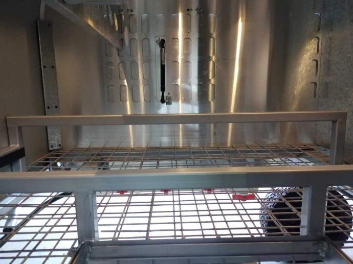 Perch bars and double mesh floor, view inside of the chicken caravan 10