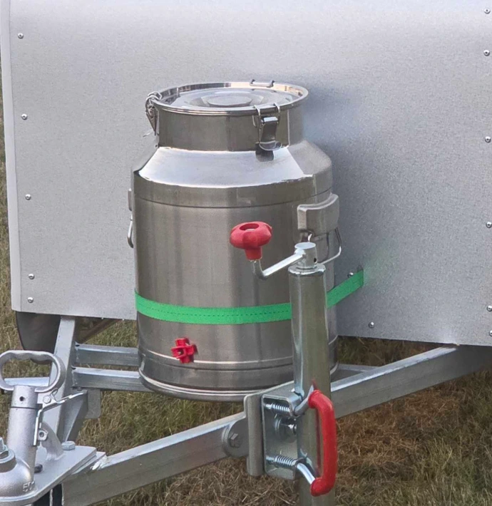 A frame with heavy duty water drum for chickens to have fresh water